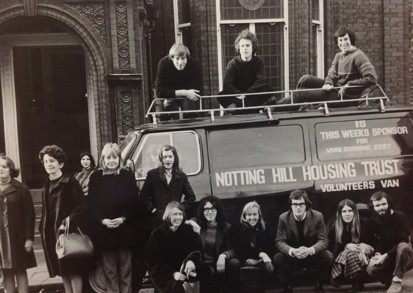 Old black and white picture showing people with a Notting Hill Housing Trust van