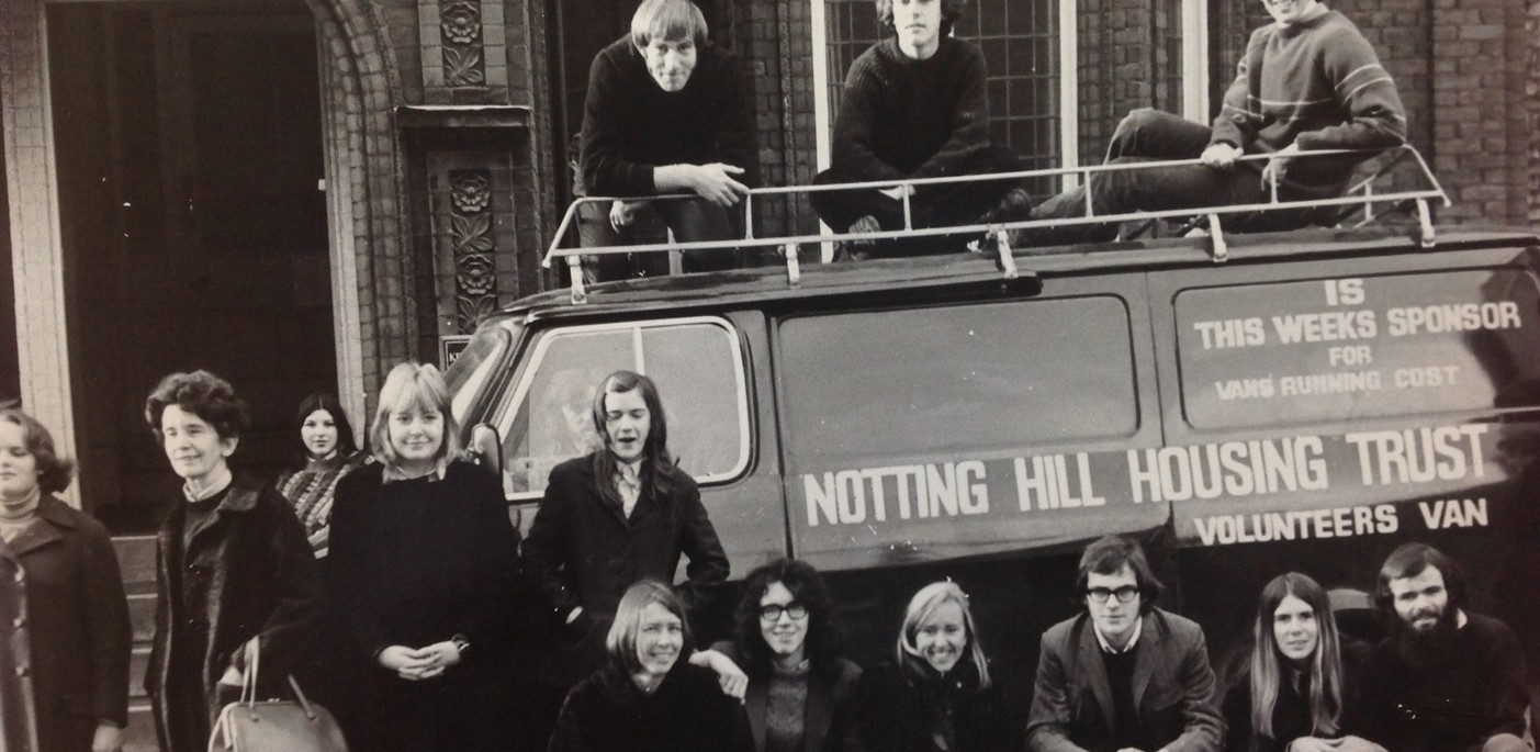 Old black and white picture showing people with a Notting Hill Housing Trust van