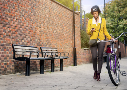 Woman pushing a bike