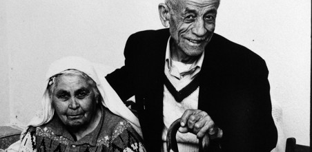 Old black and white picture showing two Notting Hill housing tenants.