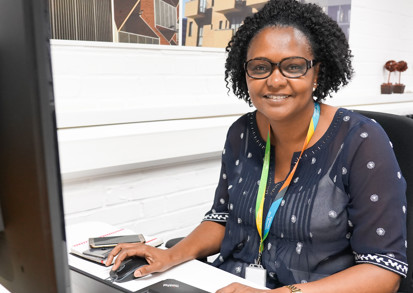 One of our housing colleagues at her office desk. 