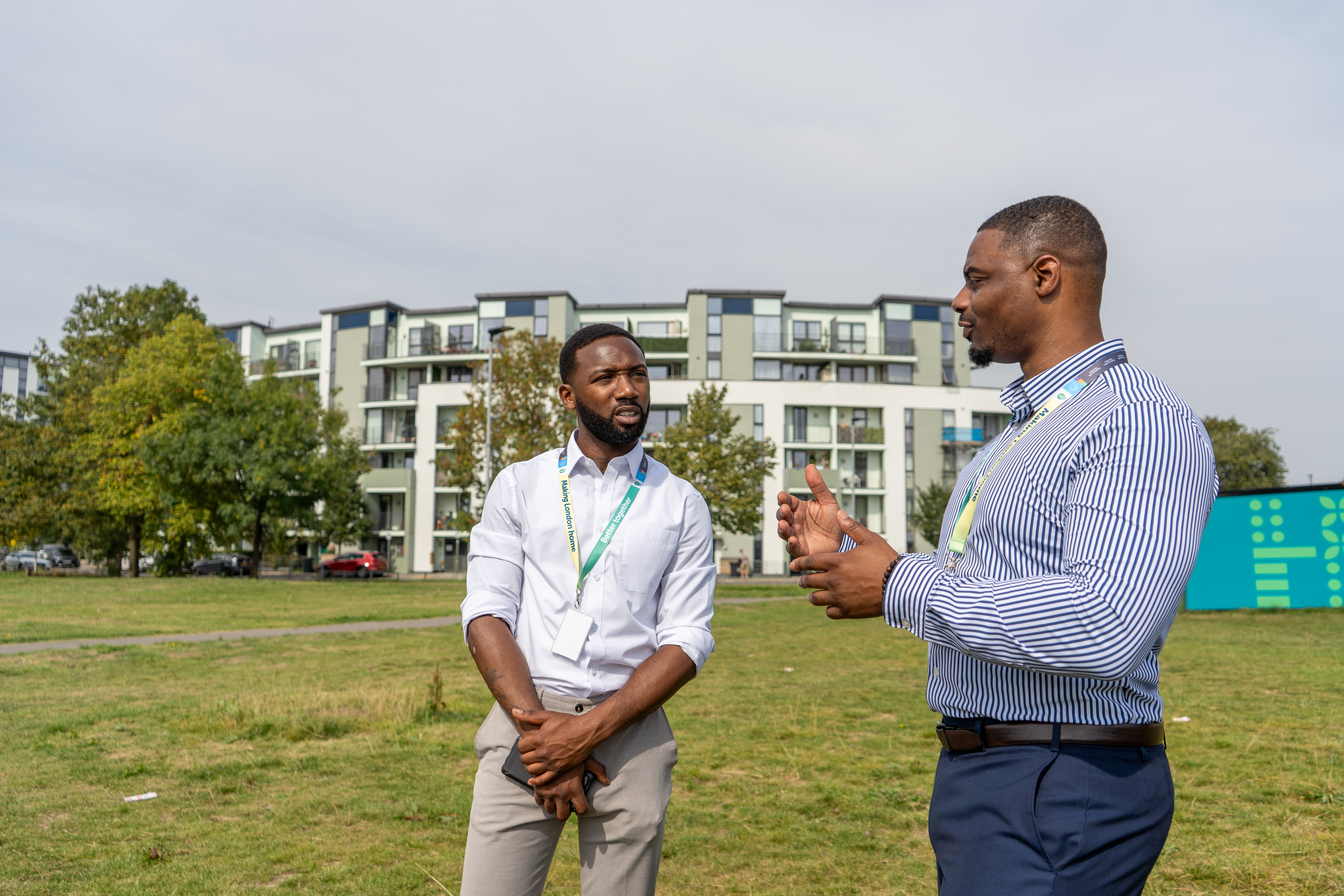 Two housing officers visiting a housing estate. 