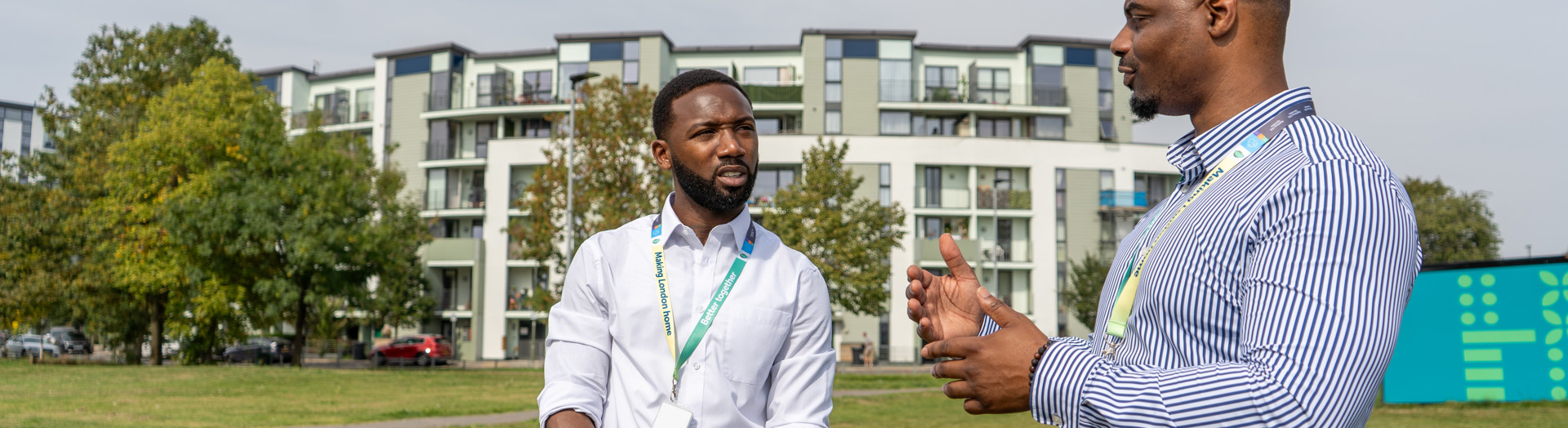 Two housing officers visiting a housing estate. 